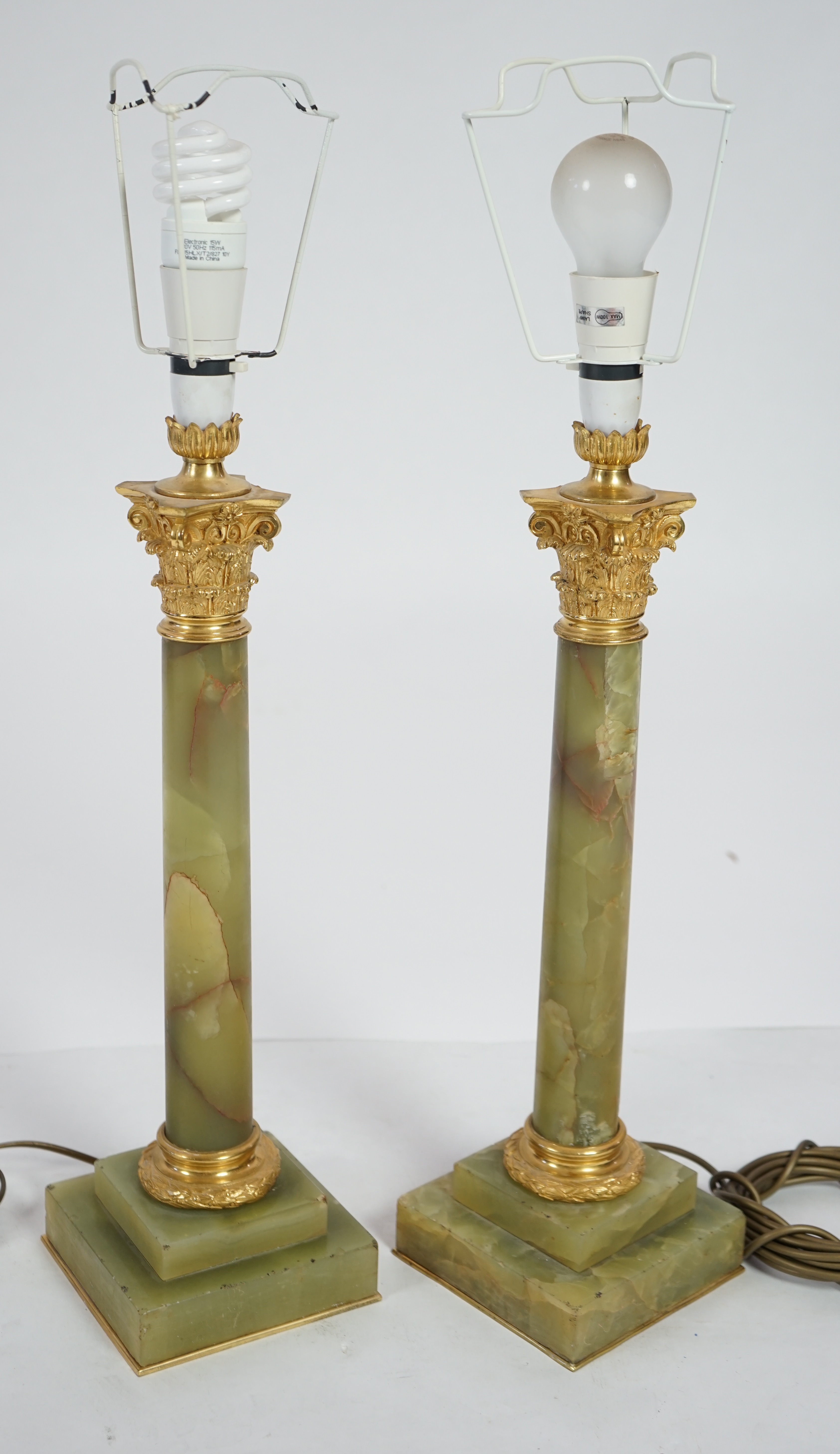 A pair of Victorian ormolu mounted green onyx table lamps